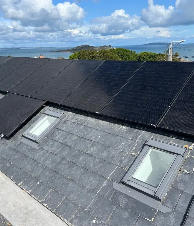 Solar panels installed on a coastal Dublin home overlooking Howth Head