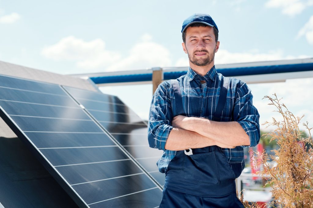 Young successful master of solar panel installation